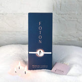Foton Pearled Candle pearls in a container for customizable designs.