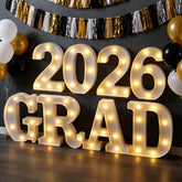 Frekkoy 8-led marquee graduation letters glow to highlight the 2026 theme at events.