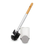 Full Circle Scrub Queen brush in holder for tidy, stylish bathroom storage.