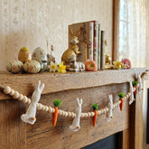 Gee Hut Easter bunny garland on mantle adds warm rustic charm.