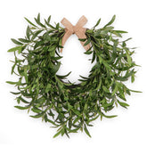 Generic artificial olive wreath for front door enhances year-round curb appeal.