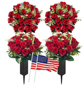 Generic cemetery flowers with spiked vases ready for outdoor graves