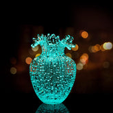 Generic handmade glass vase with luminous waves front view, ideal as a centerpiece.