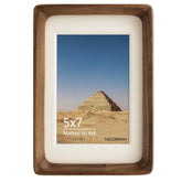 Generic walnut photo frame on table with 5x7 mat for warm memories