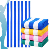 Genovega oversized stripe towel blue on beach, quick-drying and ultra-soft.