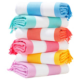 Genovega oversized Turkish towel in stripe design for comfortable beach lounging.