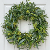 GinzeTop 24-inch olive wreath on front door enhances curb appeal with lush greenery.