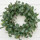 GinzeTop 24-inch eucalyptus wreath on front door for instant curb appeal.