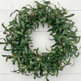 GinzeTop olive wreath on front door showcases year-round curb appeal.
