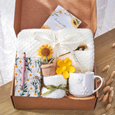 GivLovely Thinking of You box cover with sunflowers, gift-ready presentation that brightens her day.
