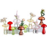 Glasseam mushroom propagation vase with colorful cap design holding a single stem for table decor