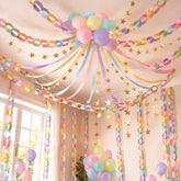 Gleebixi pastel streamers create a soft room backdrop for photos.
