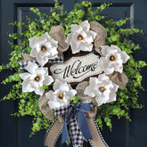 GLIDLION magnolia and eucalyptus wreath on front door for year-round curb appeal.