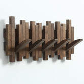GOGREEBELL natural wood coat rack with flip-down hooks for space-saving entryway storage.