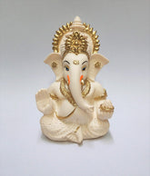 Gold Art India Ganesha idol on car dashboard adds devotional presence