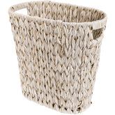 GRANNY SAYS wicker trash can with oval opening for easy waste disposal.