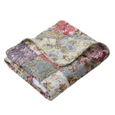 Greenland Home Blooming Prairie quilt block close-up with vibrant colors and precise stitching.
