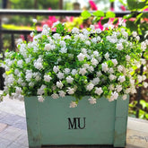 Grunyia 12-bundle outdoor artificial flowers brighten porch year-round.
