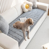 Gumfolk pet couch cover on grey sofa protects against wear and spills