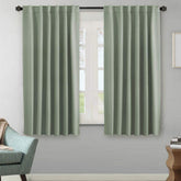 H.VERSAILTEX blackout curtain panel in light sage with soft microfiber and light control.