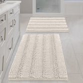 H.VERSAILTEX Ivory bath mat with stripe design for post-shower comfort.