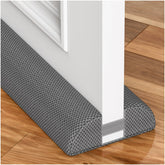 HADOR draft stopper on a door front view seals gaps to reduce drafts.