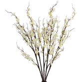 HANDIC cherry blossom branches in a vase create a romantic centerpiece.