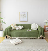 HANDONTIME Green Sofa Cover with tassel and herringbone detail protects against spills and wear.