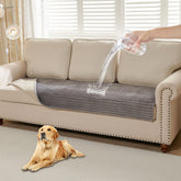 HAOMAIJIA waterproof dog couch cover on a grey sofa protects furniture from spills.