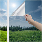 Haton window privacy film on front entry glass; one way privacy with a sleek silver look.