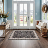 Hazo Haus Black Boho Entry Rug front view showing non-slip backing for secure placement.