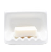 Hazzga soap dish on shower wall with vintage ceramic finish for easy soap access.