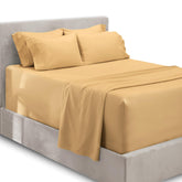 Hearth & Harbor extra deep pocket queen fitted sheet on bed, camel color, for tall mattresses.