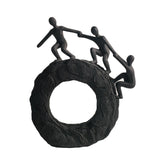 Hebdids abstract sculpture with climbing figures for stylish living room display.