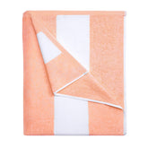HENBAY cotton oversized beach towel 70x35 inches laid flat for poolside lounging and quick drying.