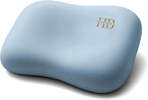 HighBeds cervical neck pillow beside a side-sleeper, highlighting neck support.