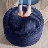 HIGOGOGO navy round pouf front view, inviting soft seating for a living room.