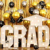 HILAVO Grad 3ft letters glow to create a standout graduation photo backdrop.