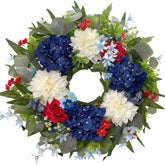 HipTree patriotic wreath on front door with red, white and blue florals for curb appeal.