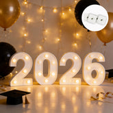 Hobrad 2026 light-up letters centerpiece with a warm graduation glow