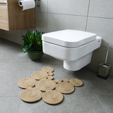 Home Turko Boho Jute Bath Mat in a bright bathroom; demonstrates modern design and moisture absorption