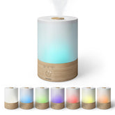 Homedics humidifier emitting visible mist to show active humidification in a bedroom