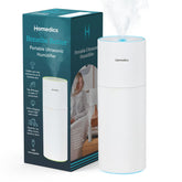 Homedics portable humidifier emitting mist for a fresh bedroom atmosphere