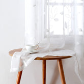 HOMEIDEAS white sheer curtains with embroidered leaf pattern offering elegant privacy.