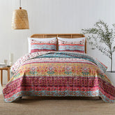 Horimote Home boho style king quilt set features vibrant florals and stripes for a bright bedroom.