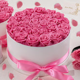 Hover Flower 27 Forever Roses in pink in a white box, a lasting keepsake gift.