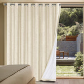 H.VERSAILTEX Linen Blackout Curtain in Bleached Sand blocks light and adds texture.