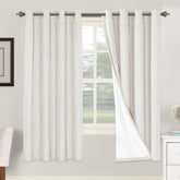 H.VERSAILTEX linen blackout curtains (72in, ivory) providing full light control and privacy.