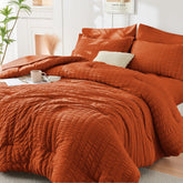 HYMOKEGE Burnt Orange Queen Comforter Seersucker closeup shows texture and color for elegant bedding