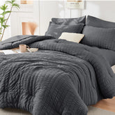 HYMOKEGE seersucker king comforter close-up showing soft texture and wrinkle resistance.